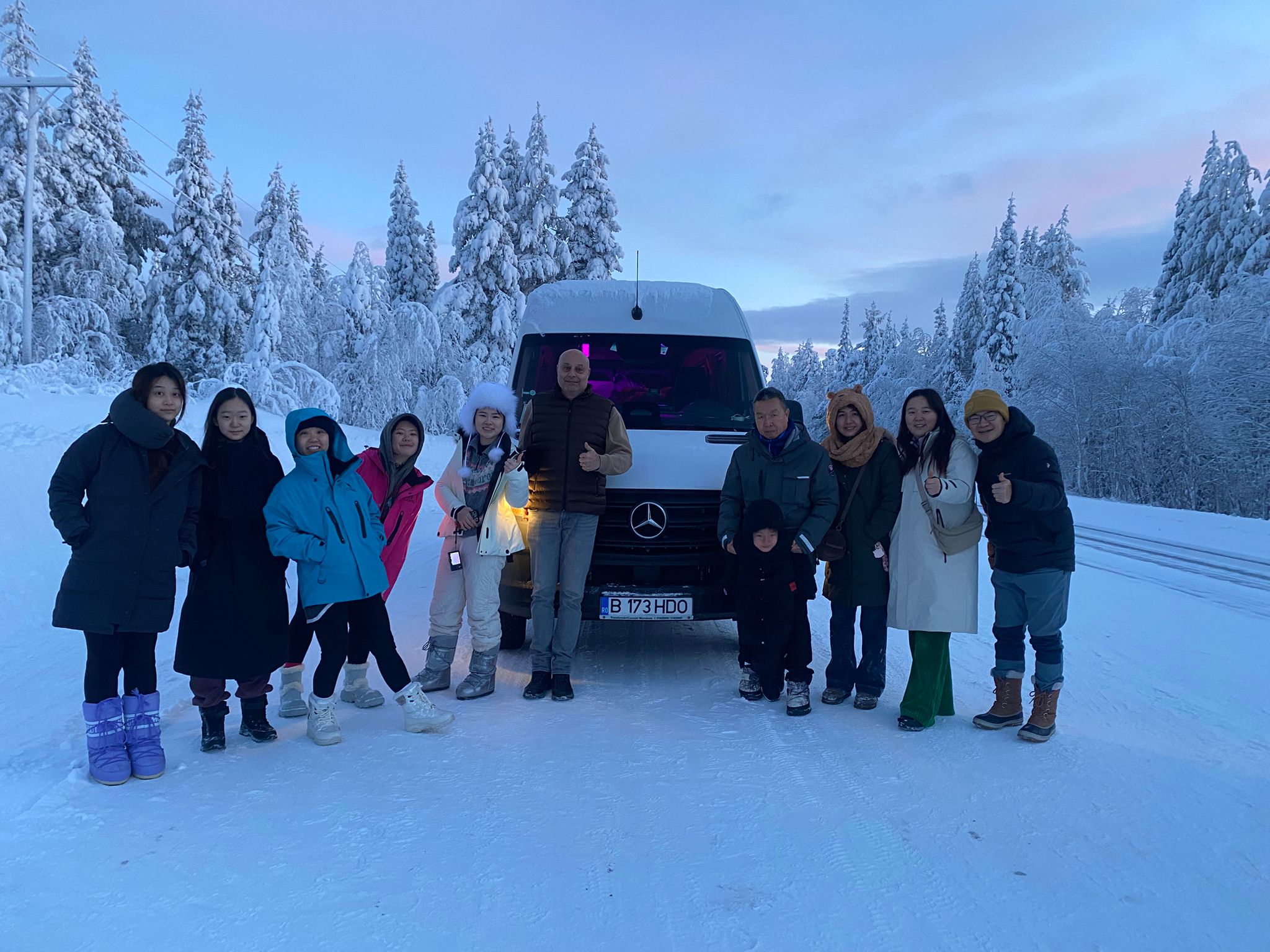 Group of tourists in winter landscape