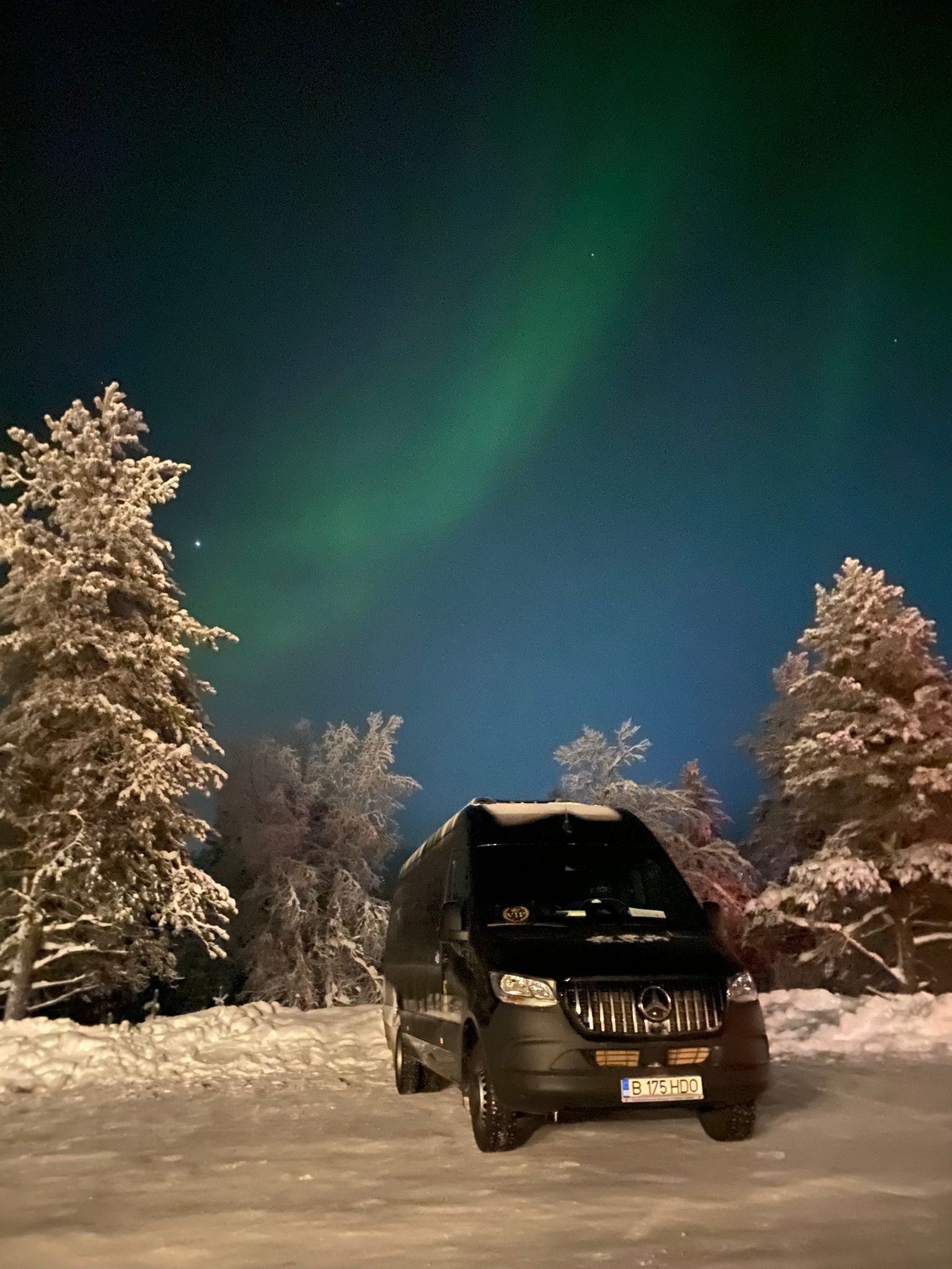 Sprinter minibus under the Northern Lights